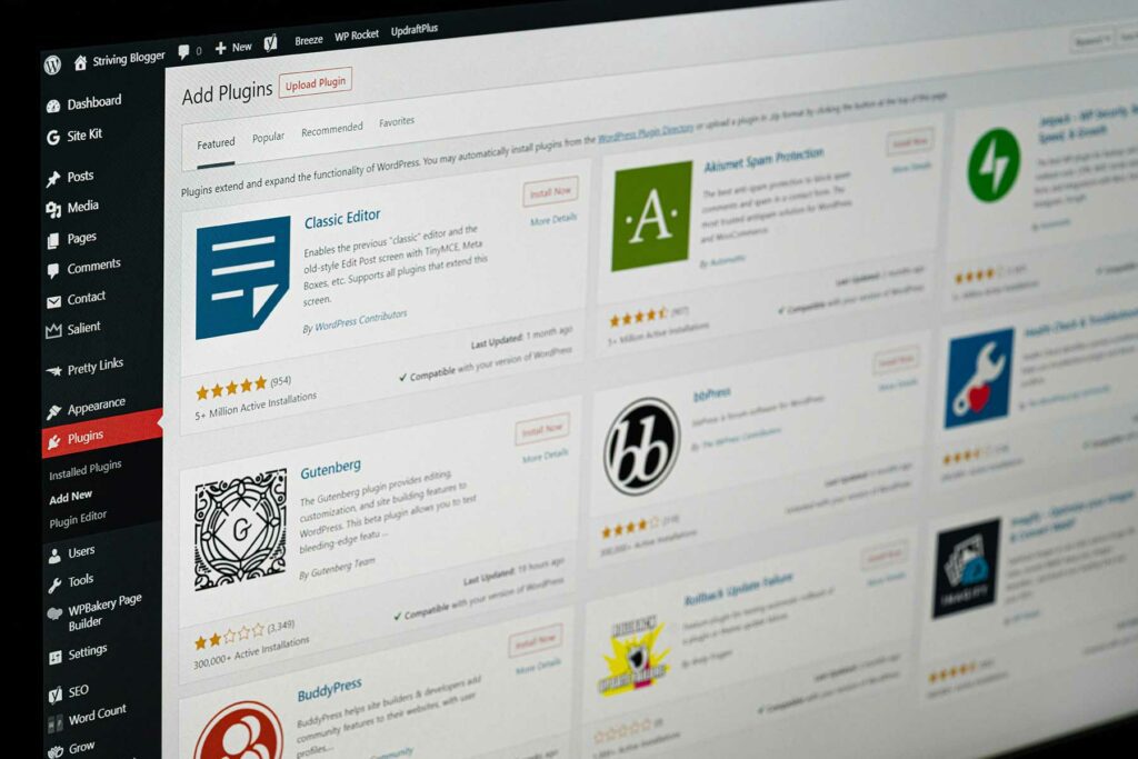 The image displays a computer screen showing the WordPress dashboard, specifically the "Add Plugins" section. Various plugins are listed, including "Classic Editor," "Gutenberg," "Akismet Spam Protection," and "bbPress," each with star ratings and installation counts. The interface features a sidebar with navigation options like "Dashboard," "Posts," "Media," and "Plugins." The overall layout is clean and user-friendly, designed for managing WordPress plugins.