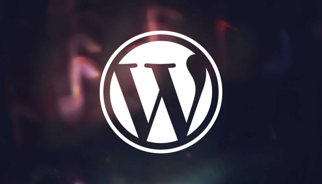 A stylized logo of WordPress is displayed prominently in the center. The logo features a bold, white "W" enclosed within a circular outline. The background is a blend of dark colors with soft, blurred light effects, creating a modern and dynamic appearance.